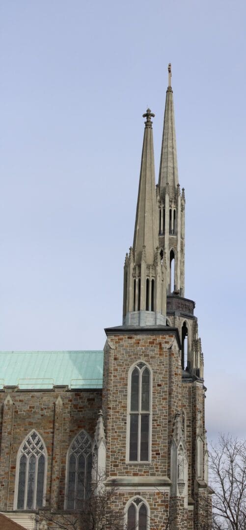 A church steeple with two large pointed tops.