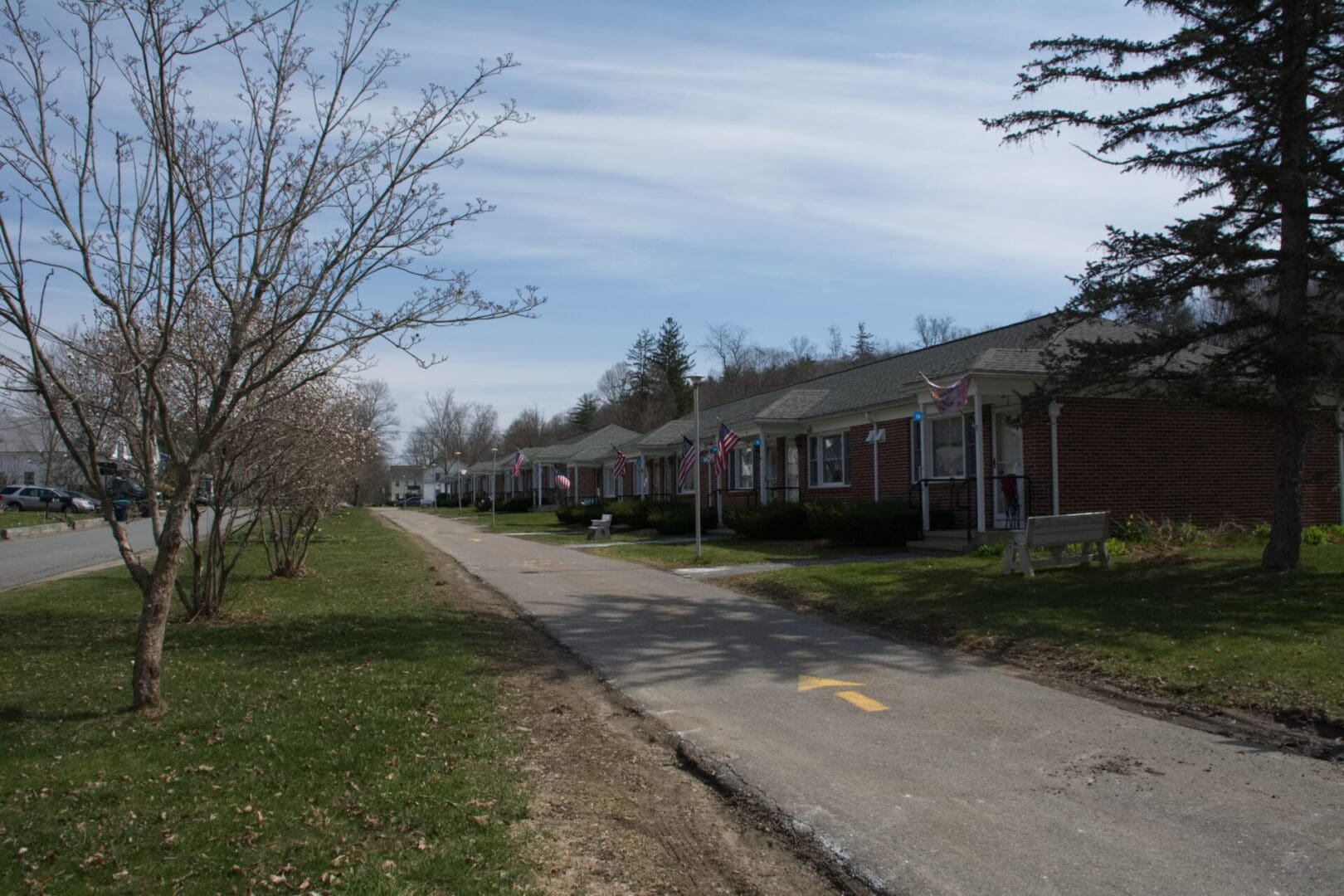 A row of houses on the side of a road.